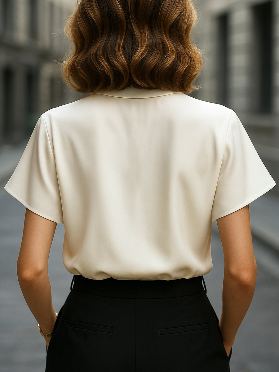 Uneven Hemmed Silk Top with Unique Neckline Cutout Feature