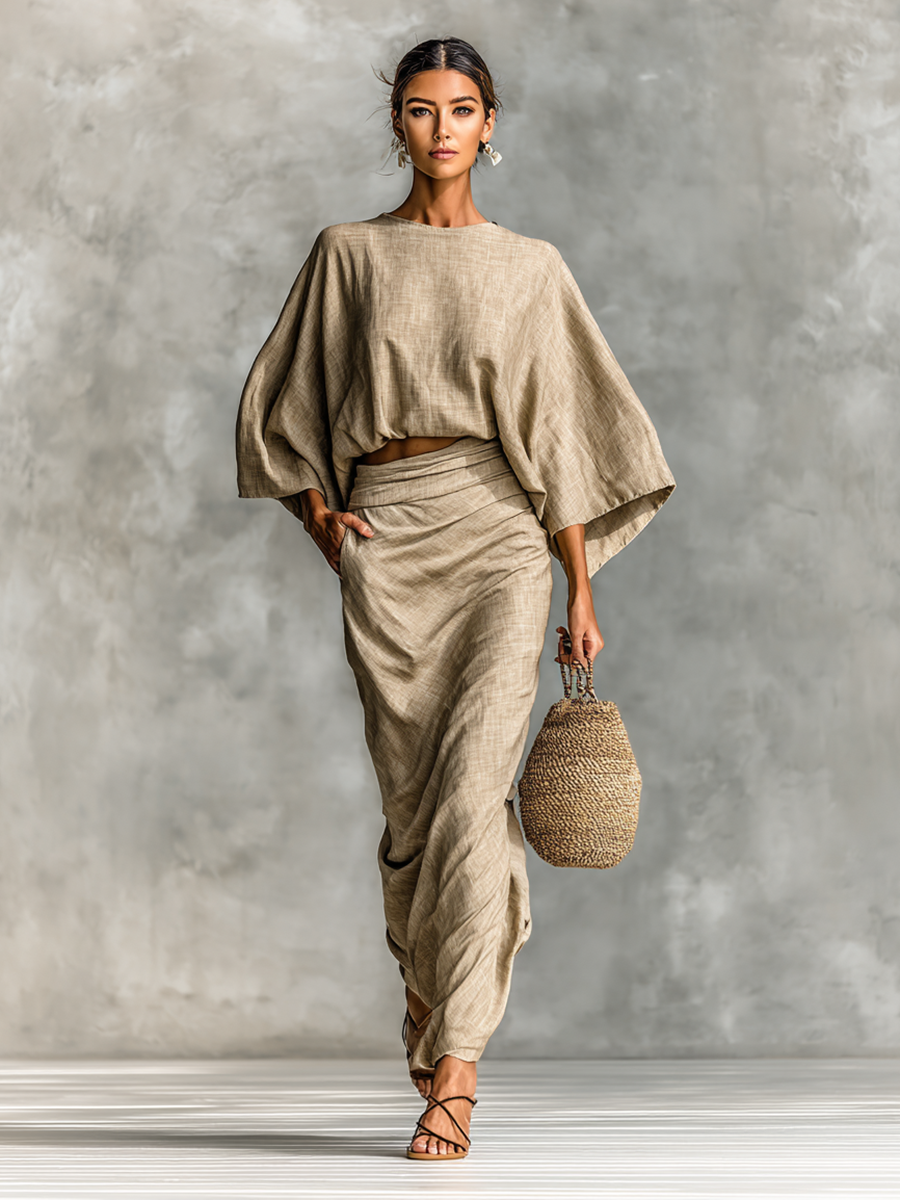 Two-piece ensemble featuring a flowing maxi skirt and oversized batwing sleeves