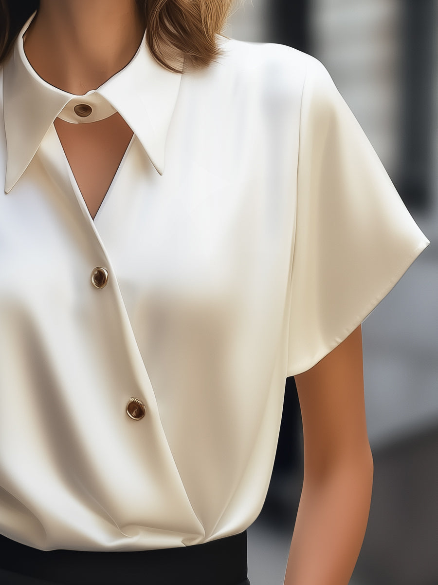 Uneven Hemmed Silk Top with Unique Neckline Cutout Feature