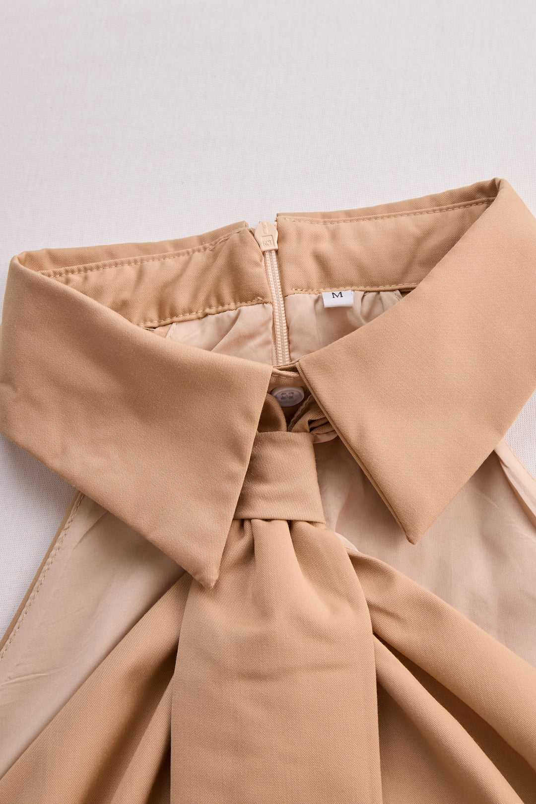 Chic Sleeveless Cowl Neck Top with Adjustable Tie Feature
