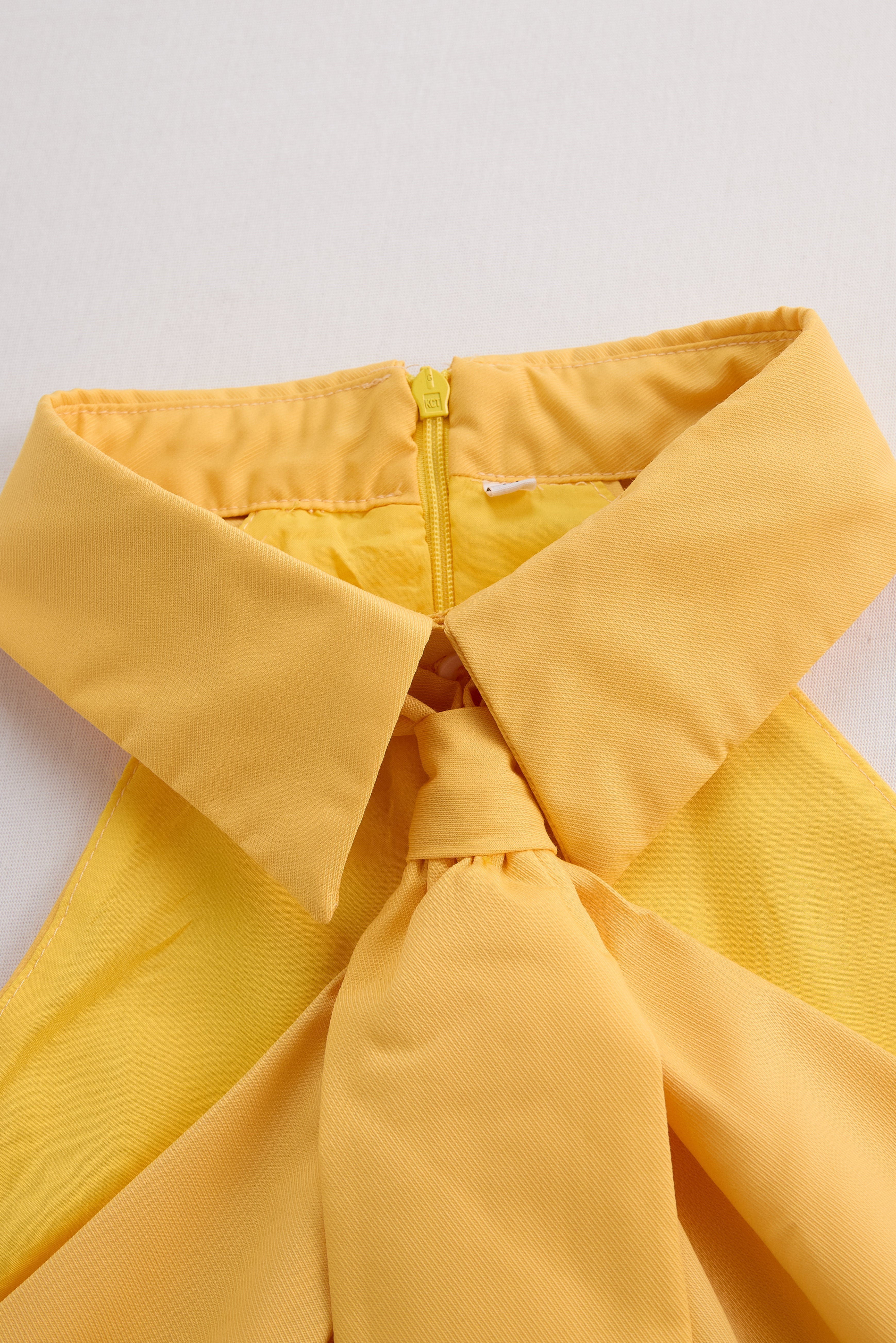Chic Sleeveless Cowl Neck Top with Adjustable Tie Feature